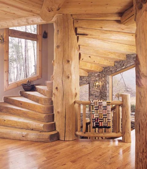 Beautiful winding staircase built around a full timber support.
