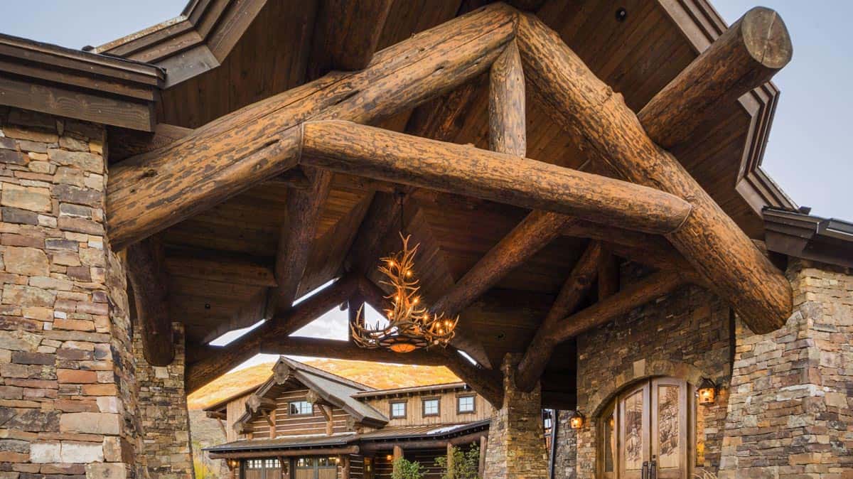 Close up of the log work on a portico. Large beams creating a beautiful entrance to a custom built home.