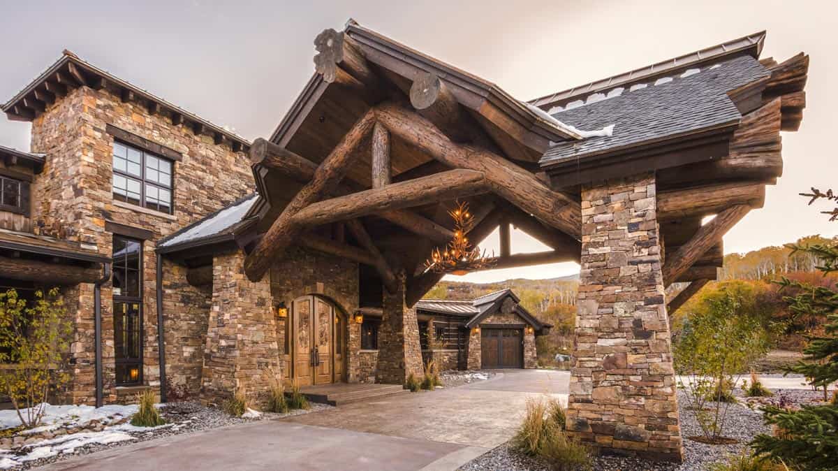 Large portico/driveway on a custom stone and log home.