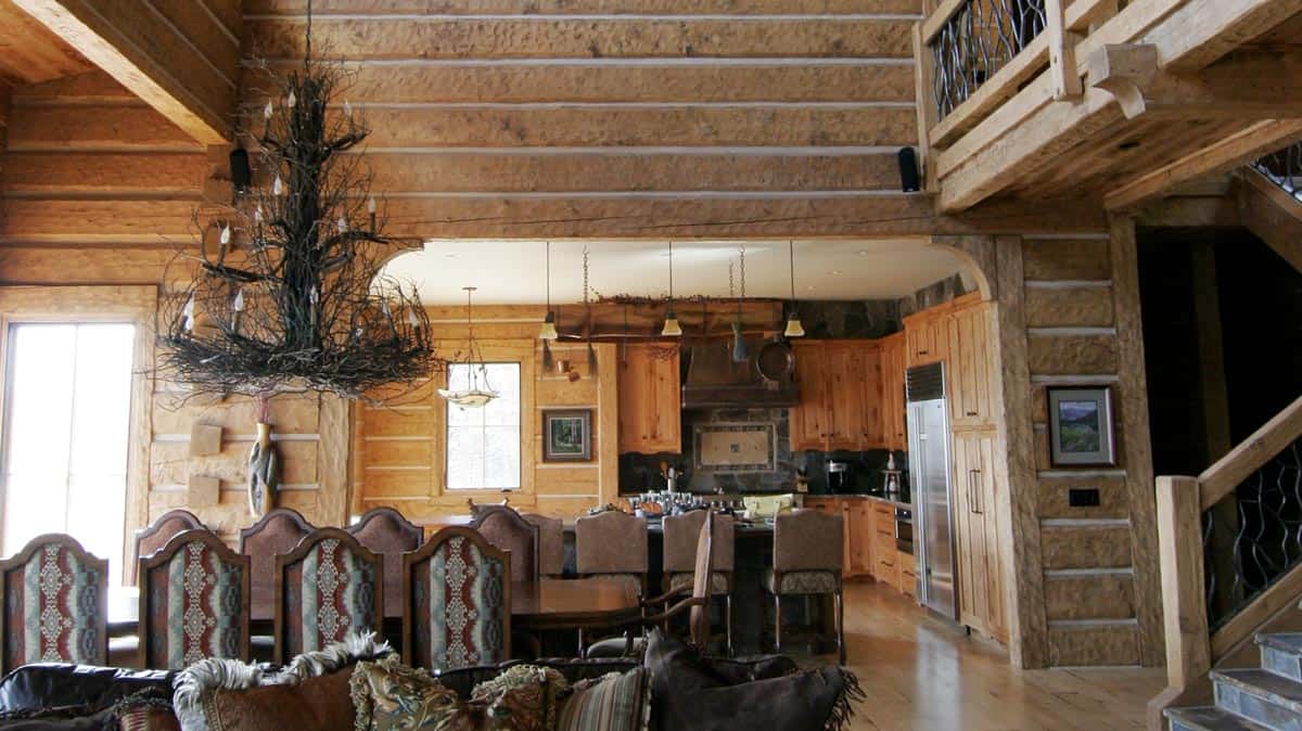 Large dining room with woven wood chandler and Appalachian Dovetail Log style walls.