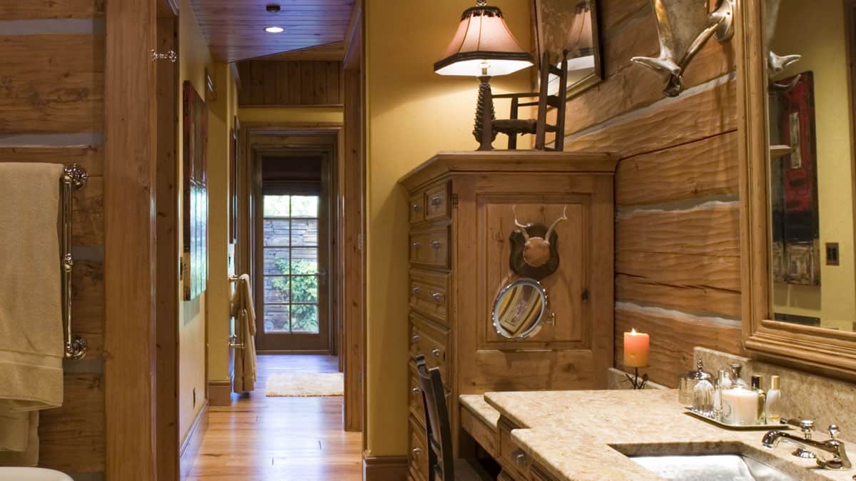 Bathroom and hallway in a log home.