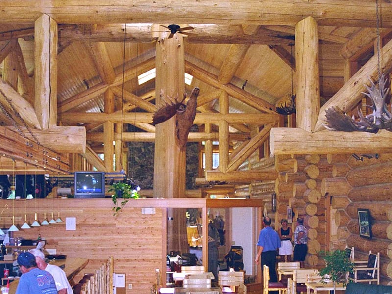 Interior of Hidden Lakes Golf dinning area. Wooden sculpture of Large bull moose is prominent.