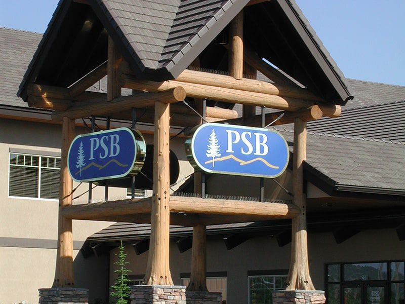 Close up of natural log portico with Panhandle State Bank signs