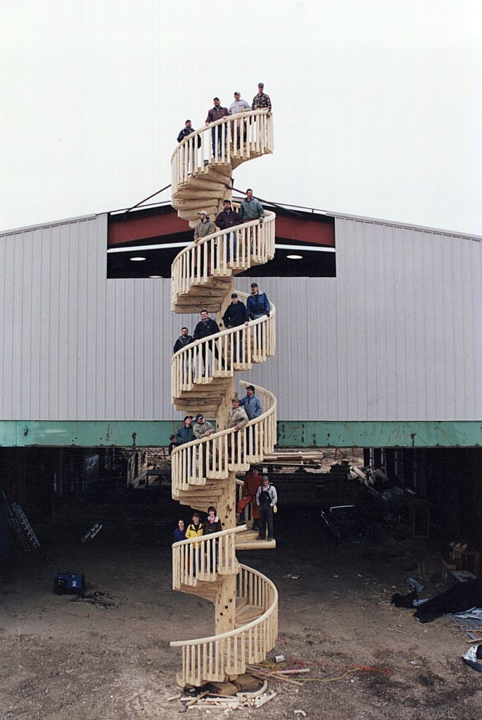 5 story spiral staircase handmade by Caribou Creek Log Homes