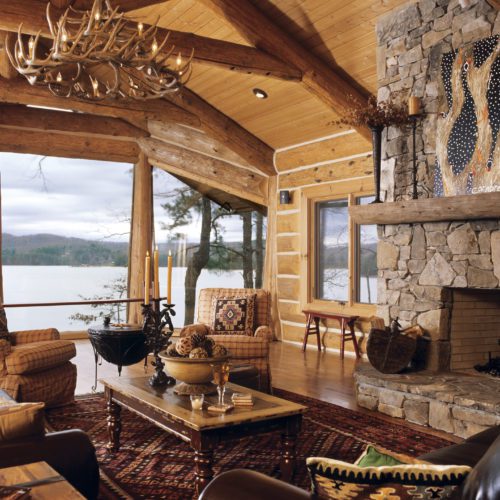 This lodge style log home is decorated with southwestern accents and offset with a gorgeous antler chandelier.