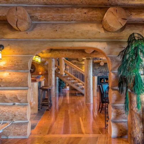 Interior log walls like this bring the cabin feeling throughout the home.