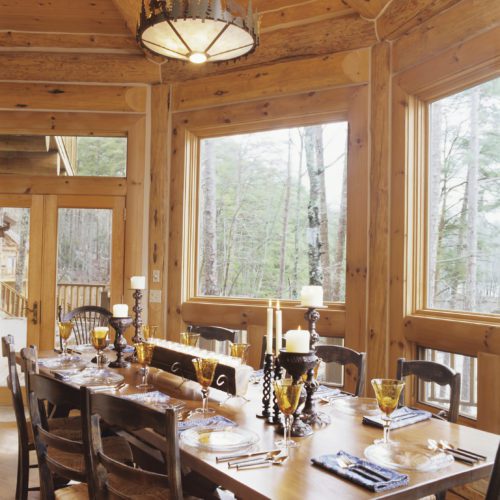 Imagine Thanksgiving dinner at this log cabin dining room with tranquil nature views.