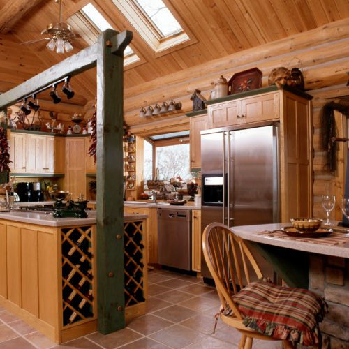 Country cottage vibe in this custom log home kitchen.