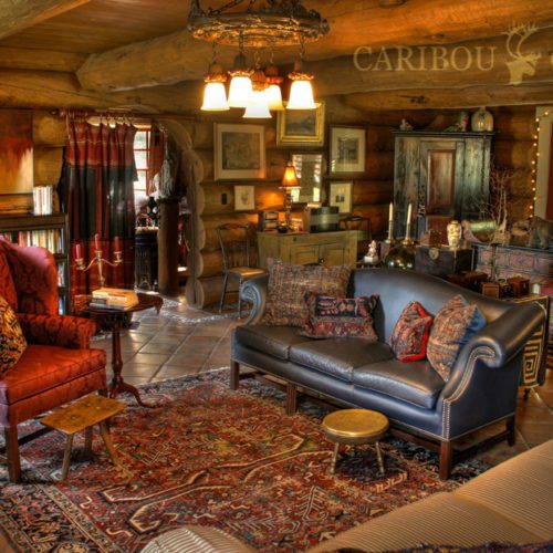 This custom home is adorned with fine art and bold colored furniture with a Bohemian vibe.