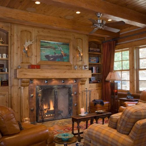 This North Idaho Homes large accent timbers and a cozy fireplace to snuggle close by in winter.