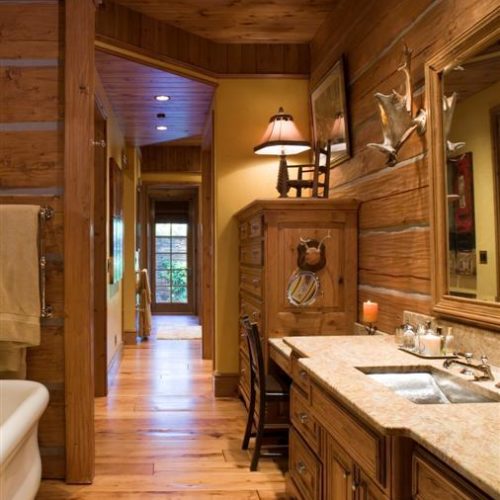 This log home uses narrow bathroom space elegantly with this layout.
