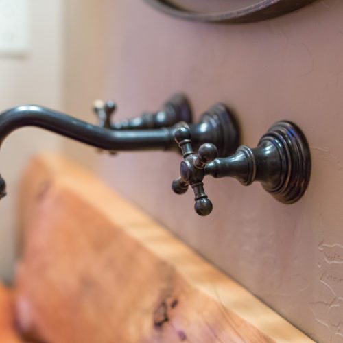 Creative faucets add flare to any cabin bathroom.