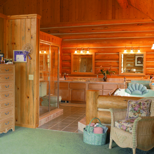 This chink style log home is finished with this custom master bathroom.